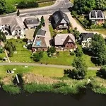 Ferienbungalow Mit Terrasse Und Seeblick In By Interhome *